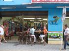 In Guatape, there are little murals next to all buildings. What do you notice is happening in this one?