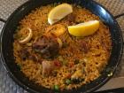 Mixed paella with both chicken and seafood. Notice the size of the dish. The pan is not more than a thumb deep.