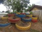 These are old tires reused as planters in front of a kindergarten classroom 