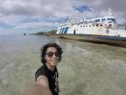 On a beach in Zanzibar next to an abandoned ship