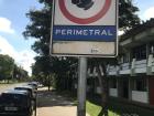 The university campus is located on top of a huge hill, so many people offer rides to students who wait by these signs