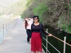 A friend and me taking a leisurely walk along the riverside