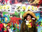 This is a picture of me in the Czech Republic by the John Lennon memorial wall! 