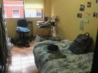 This is my bedroom (habitación) in Spain! I love the color, but the bed is a bit small for how tall I am!