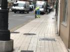 A lot of the workers in the morning go though the streets sweeping up the garbage on the sidewalks so the streets are clean.