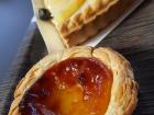 A delicious fruit tart and a traditional Portuguese pastry, a pastel de nata