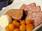 Some of my purchases at the market, including Mirabelle plums, Crottin de Chavignol cheese, pâté basque and slices of saucisson à l'ail