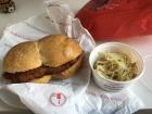 Grilled pork cutlet in a double bread roll with cabbage salad