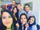 Gabriela posing with friends for a group selfie