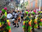 Dancers wearing tropical patterns move to the beats of the Chirimía music