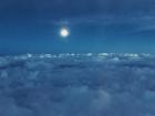 I took this photo when flying back from Germany, prior to landing in Sweden— I love how icy the moon looks when paired with the deep blue sky!