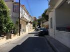 Parking, Cypriot style— half on the curb, half off