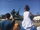 A tank and a tiny onlooker