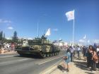 Tanks rumbling and clattering past the Cypriot flag