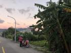 I captured the sky as the sun was setting in Guan Shan one evening. This woman was about to ride her scooter, which is what I drive every day to school.