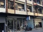 The streets of Guan Shan are lined with store fronts like this that have homes above them