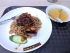 A typical plate of char siew rice served with a bowl of soup