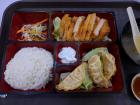 A typical meal in Singapore has meat, rice, and vegetables with sauce on the side