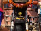 A front view of our motorcycle after my father finished decorating it