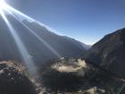 The heavy dust clouds created just after a helicopter finished landing at the helipad below