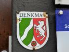 This Denkmal (memorial) symbol is on many of the buildings in Bonn to show that it's a historical place