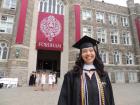 Wearing my cap and gown for Fordham graduation