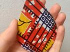 This is a pair of colorful earrings I bought at the wood carving market