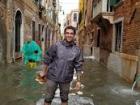 Walking through the flooded narrow streets of Venice