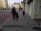 A kid going to school with his mom