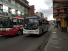 Two public buses in downtown San José. The streets are tiny here!