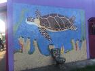 A beautiful mosaic mural (and toilet) just outside the village