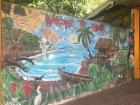 This colorful mural was in the Cahuita bus station