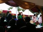 The aunts of the groom present gifts to the bride