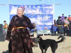 A lady with one of the racing dogs.