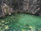 The water was so clear at the bottom of the waterfall
