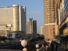 The construction sits side by side with one of Wuhan's busy pedestrian walkways