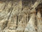 This cliff is made of very soft rock and at high tide, the ocean reaches it