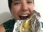Here I am eating an arepa stuffed with cheese, corn, and mushrooms