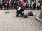 A man plays the Bodrhan drum. 