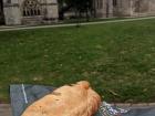 A traditional Cornish pasty in front of Exeter Cathedral