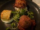 A selection of haggis, a hushpuppy and a filled pastry