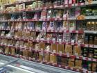An entire wall of the grocery store is dedicated to cookies, crackers and candy to go with tea