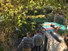 Walking down towards a terraced area and a spring