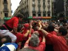 Here, they are beginning to build one of the human towers.