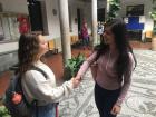 Giving a handshake to my friend at school