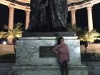 A statue of Simon Bolivar and Jose San Martin, two important historical figures in Ecuador. There are also flags for every country within South America behind them