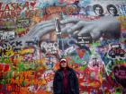 The wall has many murals like these hands reaching out the the people who walk by