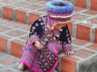 A Hmong baby dressed in traditional clothing, pictured in Thailand 