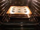 The gluten-free cookies are placed in the oven and ready for baking. 
