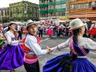Another team performs a traditional dance during a cultural parade in La Paz 